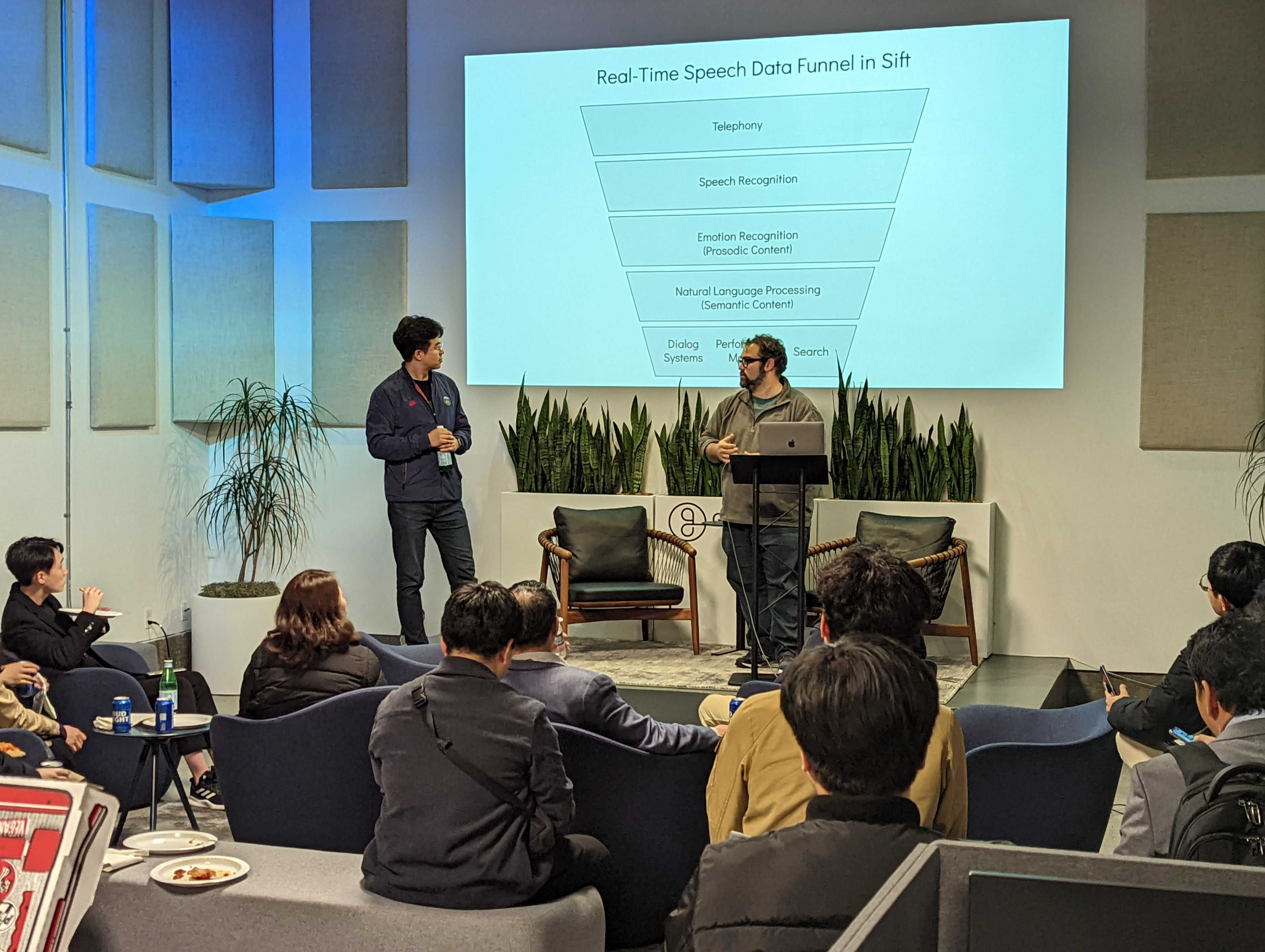 Image of co-founder Anthony presenting a talk on Gridspace Sift